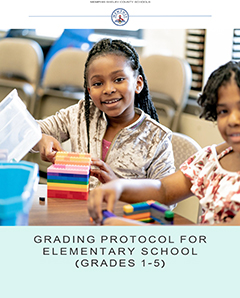 Two elementary school girls playing blocks